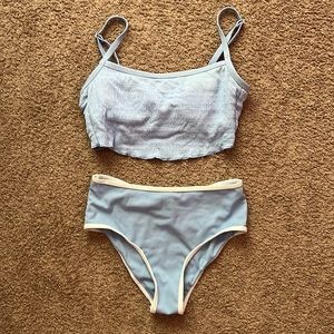 Blue two piece bathing suit.